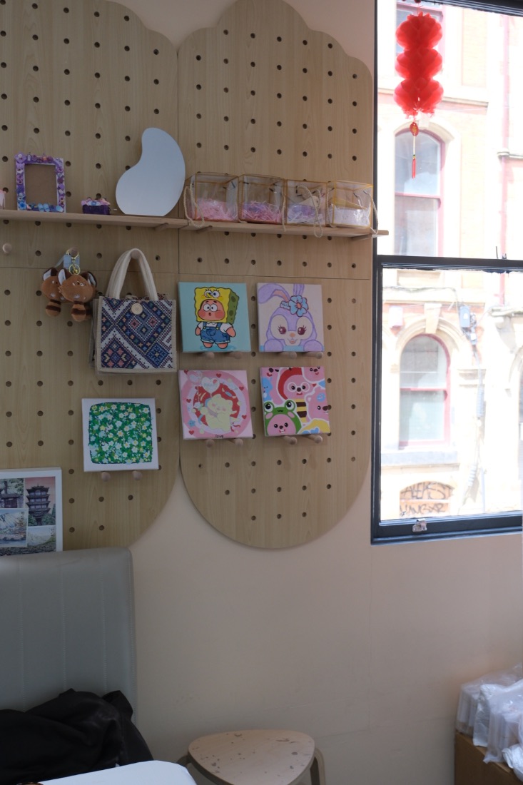 Wall of painted canvases